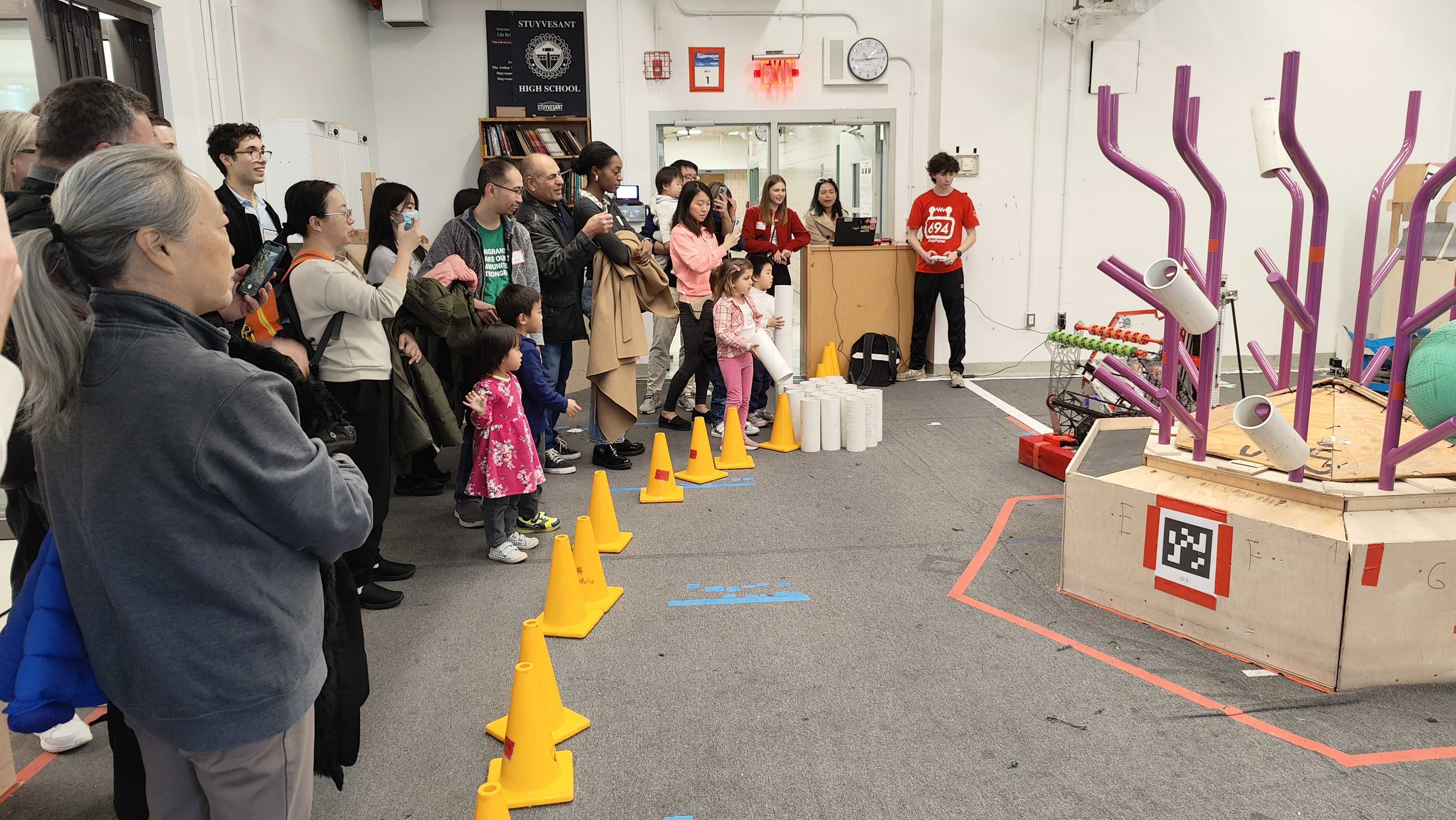 New students and parents at Stuyvesant's Open House session, looking at our robot, Aunt Mary